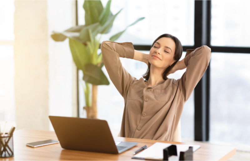 Smiling women stretching out at the office table