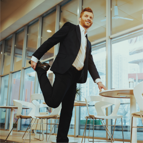 Office worker stretching out at table